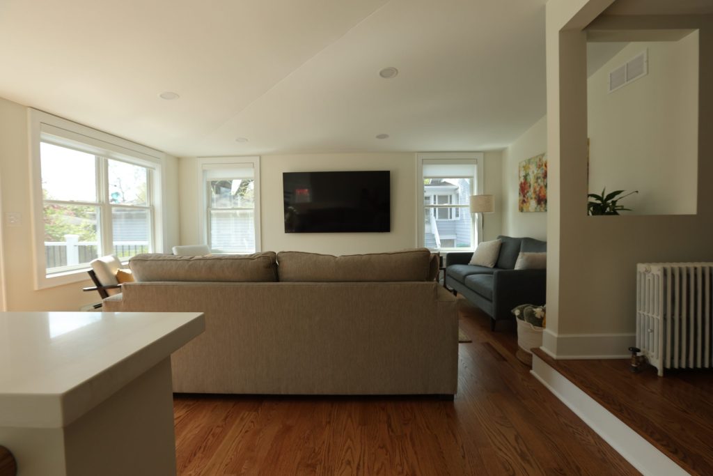 After: A spacious, light-filled family room designed for everyday comfort and entertaining.
